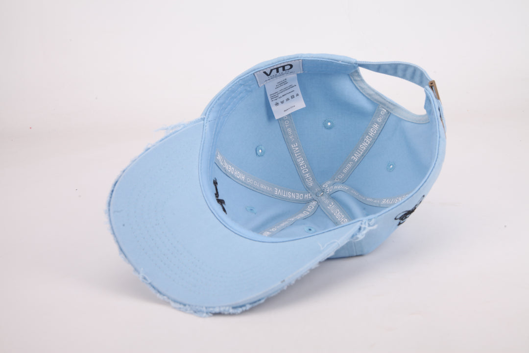 Ripped light blue cap Verb to do